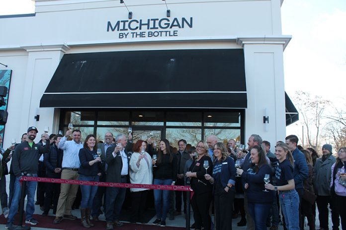 MBTB Ribbon cutting Lake Orion_Courtesy of Michigan By The Bottle Owners, staff, and guests celebrating the opening of the new Michigan by the Bottle location in Lake Orion.